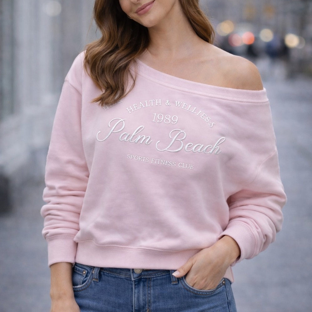 Harper Light Pink Sweatshirt Pink hangs soulder.